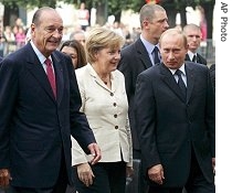 France's President Jacques Chirac, left, with Germany's Chancellor Angela Merkel, center, and Russia's President Vladimir Putin, Sept. 23, 2006