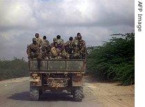 An Ethiopian military truck drives through the Afgooye settlement in Mogadishu while leaving its position, 24 Jan 2007