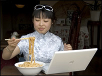 A woman using chopsticks