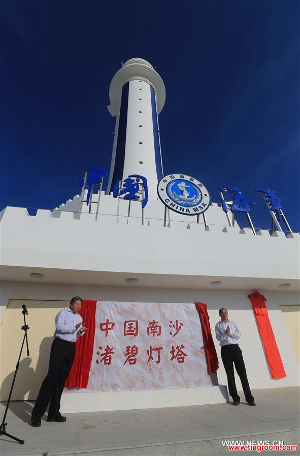 Guests attend the completion ceremony for the construction of a lighthouse on Zhubi Reef, of Nansha Islands in the South China Sea, south China, April 5, 2016. The lighthouse can provide efficient navigation services such as positioning reference, route guidance and navigation safety information to ships, which can improve navigation management and emergency response. (Xinhua/Xing Guangli) 