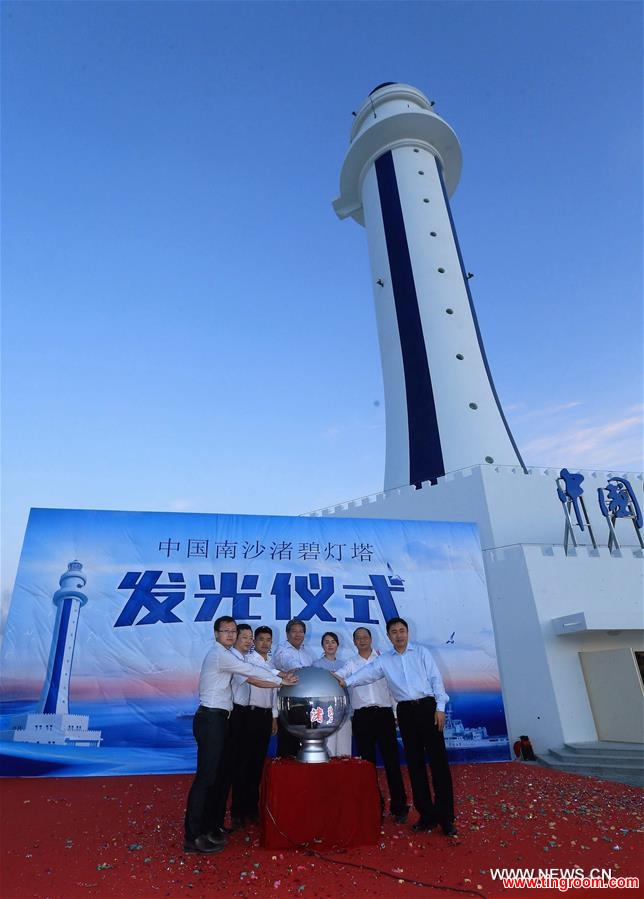  Guests attend the completion ceremony for the construction of a lighthouse on Zhubi Reef of Nansha Islands in the South China Sea, south China, April 5, 2016. The lighthouse can provide efficient navigation services such as positioning reference, route guidance and navigation safety information to ships, which can improve navigation management and emergency response. (Xinhua/Xing Guangli) 