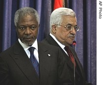 Palestinian Authority President Mahmoud Abbas, right, walks past UN Secretary-General Kofi Annan as they arrive for a joint press conference