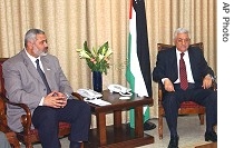 Mahmoud Abbas right, meets with Ismail Haniyeh in Gaza City, Monday