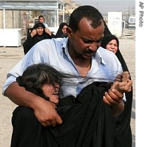 An Iraqi woman mourns her son in Baghdad's Sadr City