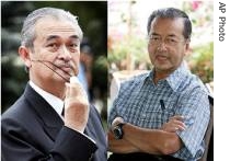Malaysia's PM Abdullah Ahmad Badawi, left, and former PM Mahathir Mohamad