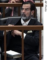 Ousted Iraqi President Saddam Hussein listens to the prosecution during the 'Anfal' genocide trial in Baghdad on Wednesday 20 Dec. 2006