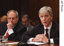 Ryan Crocker, President Bush's nominee to become ambassador to Iraq, right, testifies on Capitol Hill next to William Wood, left, nominated to become ambassador to Afghanistan