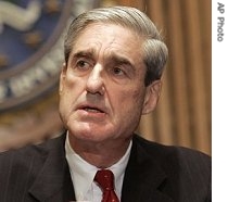 Robert Mueller meets reporters at FBI headquarters in Washington to discuss the gathering of personal information, 9 Mar 2007