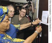 President Johnson Sirleaf cuts the ribbon at a new<br />diamond office