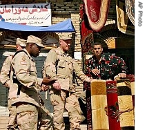 US soldiers shop for carpets at the downtown market in the center of Irbil, Iraq, 10 Nov 2005