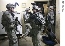 Soldiers from Alpha Company, 2nd Battalion, 7th Infantry Regiment, 4th Brigade Combat Team, 1st Cavalry Division search a home, looking for a man they suspect is affiliated to al-Qaida in Mosul, 03 May 2007