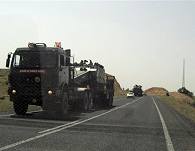 Trucks loaded with military equipment are seen heading towards the border with Iraq near the southeastern Turkish city of Nusaybin, 01 Jun 2007