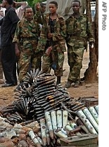 Ethiopian soldiers guard massive cache of weapons at a military compound in Mogadishu, Somalia, 14 June 2007
