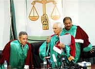 Libyan Judge Fathi Dahan, center, and his assistants leave Supreme Court, 11 Jul 2007
