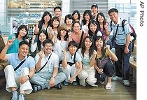 A group of South Korean Christians pose for a memorial photo before leaving for Afghanistan, 13 Jul 2007