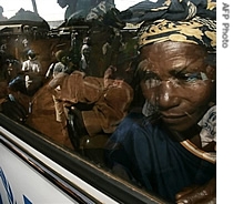 A refugee Burundian woman peers out of the window of her bus at the Mtabila camp in western Tanzania (File)