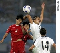North Korean women (in red) play US at World Cup in China