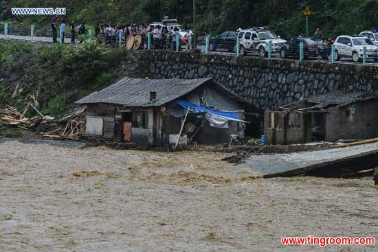 A house is seen stranded in flood in Leishan County, southwest China